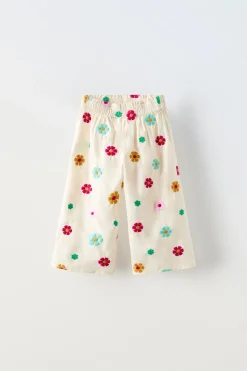 CALÇAS COM FLORES BORDADAS-ZARA New