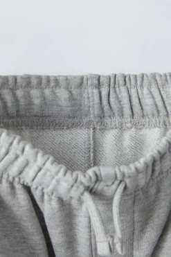 CALÇAS COM MENSAGEM BORDADA-ZARA Clearance