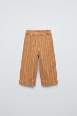CALÇAS COM PESPONTOS-ZARA Store