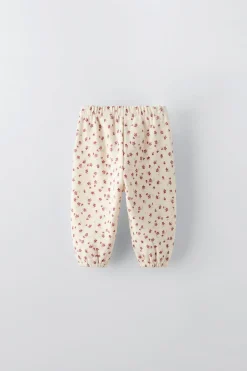 CALÇAS ESTAMPADAS COM FLORZINHAS-ZARA New