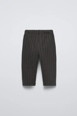 CALÇAS ÀS RISCAS-ZARA Sale