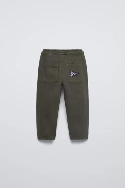 CALÇAS ÀS RISCAS COM PADRÃO-ZARA Discount