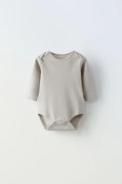 CONJUNTO DE CINCO BODIES COM COELHINHOS-ZARA Outlet