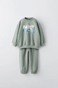 CONJUNTO JOGGING DE SWEATSHIRT E CALÇAS BLUEY © LUDO STUDIO-ZARA Discount