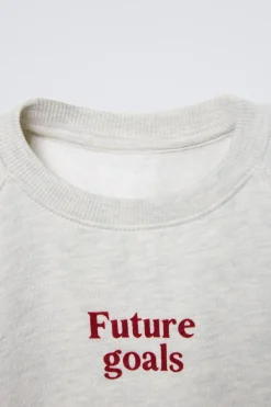 CONJUNTO JOGGING DE SWEATSHIRT E CALÇAS COM MENSAGEM FLOCKED-ZARA Online